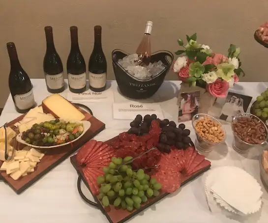 Catering spread with wine, cheese, and charcuterie for special events at Mama Cozza&rsquo;s